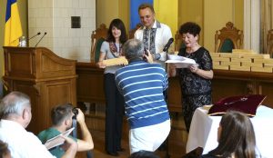 Marla receives her award from Mayor Sadovyi and Ada Dianova